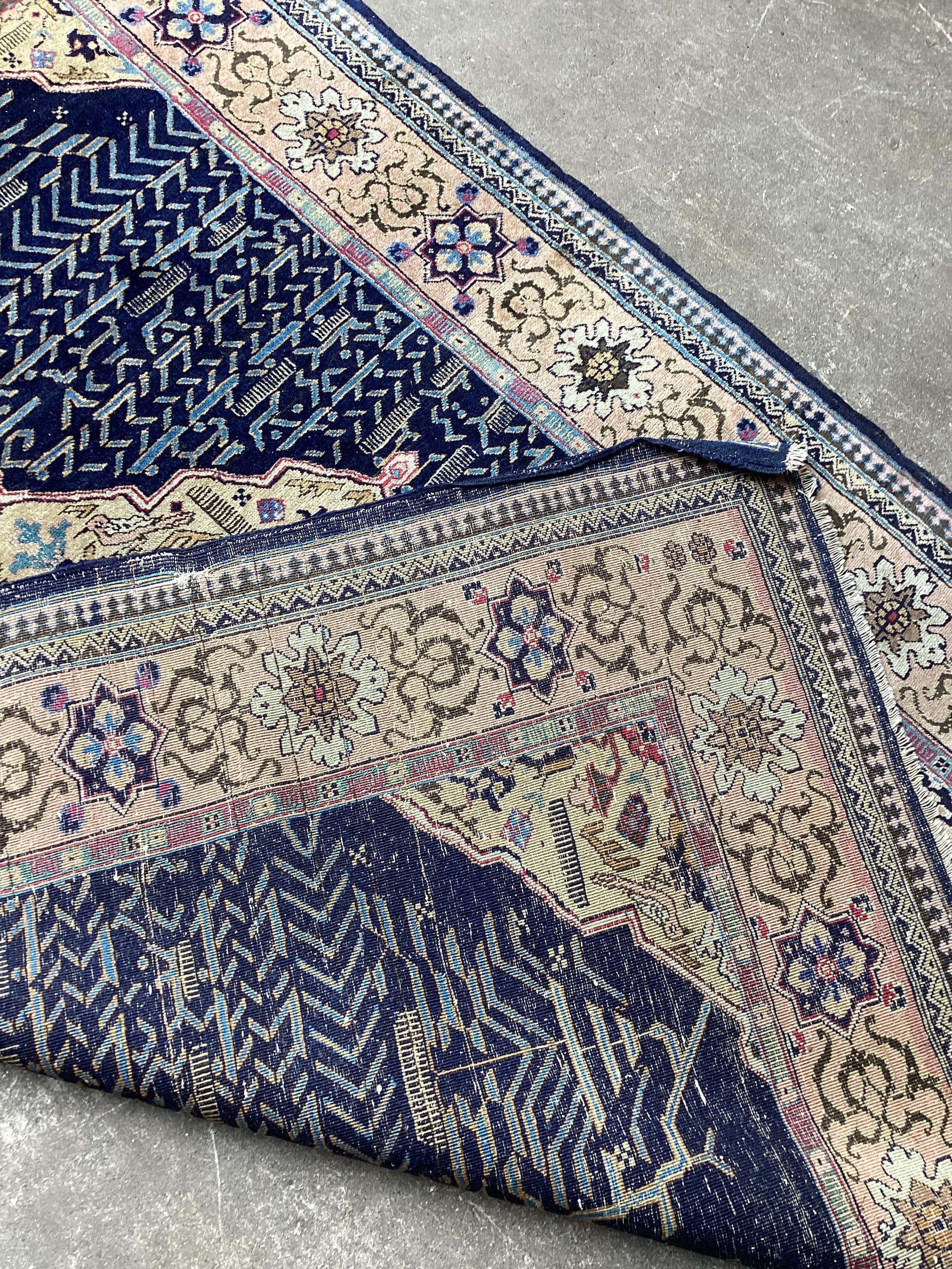 A North West Persian blue ground rug, 198 x 136cm